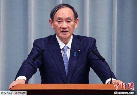 资料图为日本内阁官房长官菅义伟。