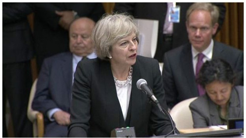英国首相特雷莎·梅呼吁全球联动应对移民危机。(BBC中文网)