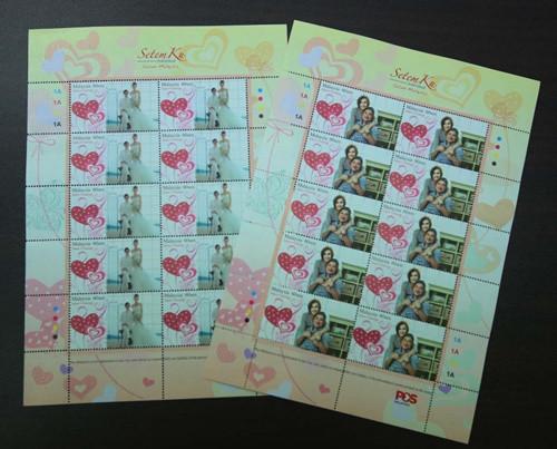 中国侨网结婚照、夫妻照，都是民众印制个性化邮票的首选题材。（马来西亚《星洲日报》）