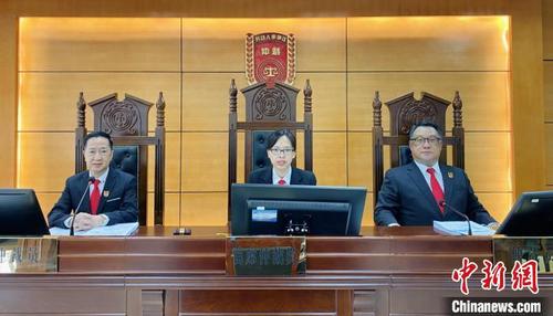 中国侨网澳门仲裁员李国辉、吴文俊合议参审涉港澳劳动争议案件 南沙区政府 供图